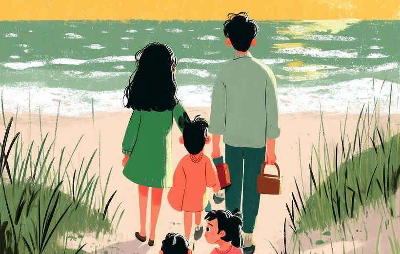 A family walking together on the beach.